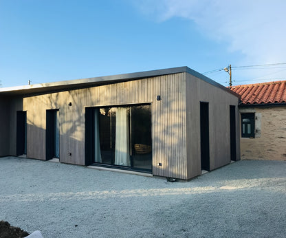 Photo après travaux d'une extension en ossature bois et rénovation d'une grange aux Sorinières 44